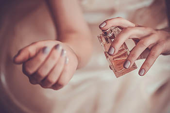 applying perfume